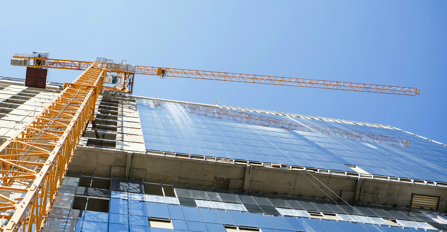 Crane building modern glass building